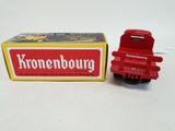 a red toy truck that is next to a box of cigarettes