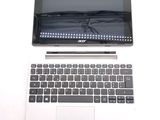 a laptop computer sitting on top of a white table
