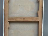 an old picture of a wooden frame with a piece of paper on top of it