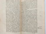 an open book with a black and white image of a person holding it