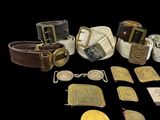 many different types of belts and buckles on a black background