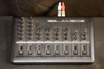 a close up of a sound board sitting on top of a table