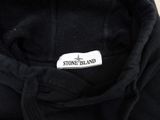 a black hoodie with a stone island label on it