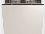 a white dishwasher sitting inside of a white dishwasher