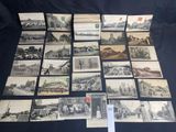 an old photo of a bunch of old postcards on a table