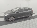the grey car is parked in the garage on the checkered floor