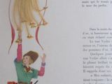 une photo d'un livre sur lequel figurent une femme et un oiseau