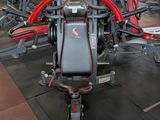 a gym with a lot of machines in the room