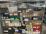 a metal cart with many items on it in a warehouse