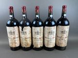 six bottles of wine are lined up in a row