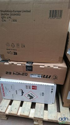 several boxes are stacked on a pallet in a warehouse