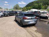 many cars parked in a parking lot on a sunny day
