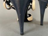 a close up of a pair of high heeled shoes on a table