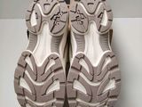 the soles of a pair of shoes are shown on a white surface