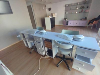 a desk with a computer on it in a room
