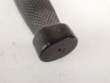 a close up of a knife on a white surface