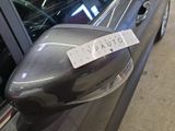 a parking ticket attached to the side of a car