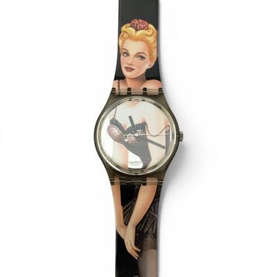 a close up of a watch with a picture of a woman on it