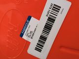 an orange suitcase with a barcode on the side of it
