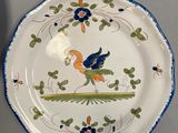 two plates with designs on them are sitting on a table