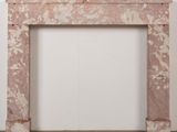 a marble fireplace surround with a clock on top of it