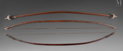 three different types of bows and arrows on a gray background