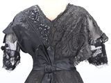 black lace dress with black sash and sleeves