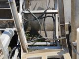 a ladder that is leaning against a wall next to a building