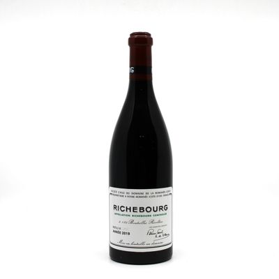 a bottle of wine that is sitting on a table