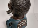 a figurine of a man with a golf ball on top of it