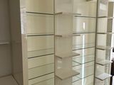 a white shelf with a sign on it in a store