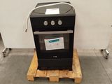 a black stove sitting on a pallet in a room