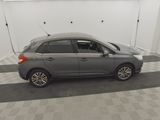 an image of a grey car in a garage