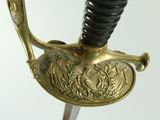 a close up of a sword on a white background