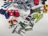 a lot of different toys that are on the table