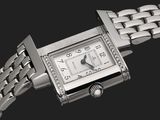 gros plan d'une montre-bracelet entourée d'une chaîne