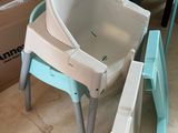 a baby seat that is sitting on top of a chair