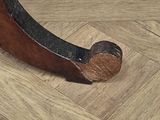a close up view of a wooden floor with a metal handle