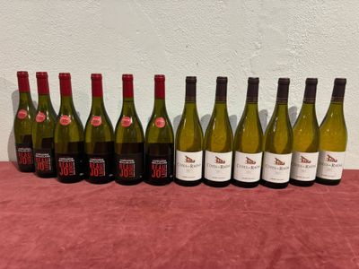 a group of bottles of wine sitting on top of a table