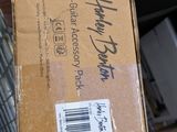 a person holding a box with a sticker on it