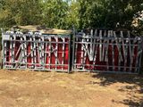 a fence that has a bunch of skis on top of it