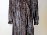 an image of a fur coat on a mannequin stand