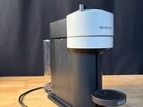 an image of a coffee maker sitting on top of a wooden table