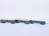 a toy train on the tracks in the snow