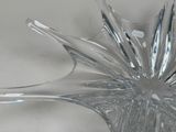 a glass bowl with a spoon and a spoon rest on it
