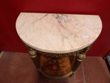 a marble top table with a clock on it