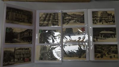 a picture of a display of old photos on the wall