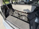 a trunk of a car with a bunch of electronics in it