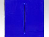 a close up of a blue plastic box with a pencil sticking out of it