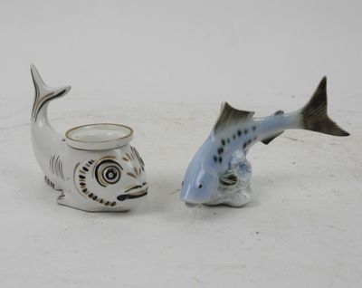 two salt and pepper shakers with a fish design on them